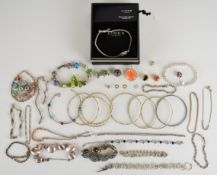 A collection of silver jewellery including seven bangles (37.5g), seventeen bracelets including