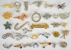Thirty-one vintage diamanté and paste brooches including scorpion, whale, trumpet, etc