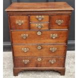 An unusual 18th century oak chest of drawers, in two parts, 76.5cm wide.
