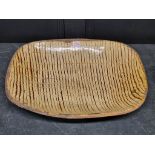 A good and large antique slipware dish, possibly Isleworth, with combed decoration, 52cm wide.