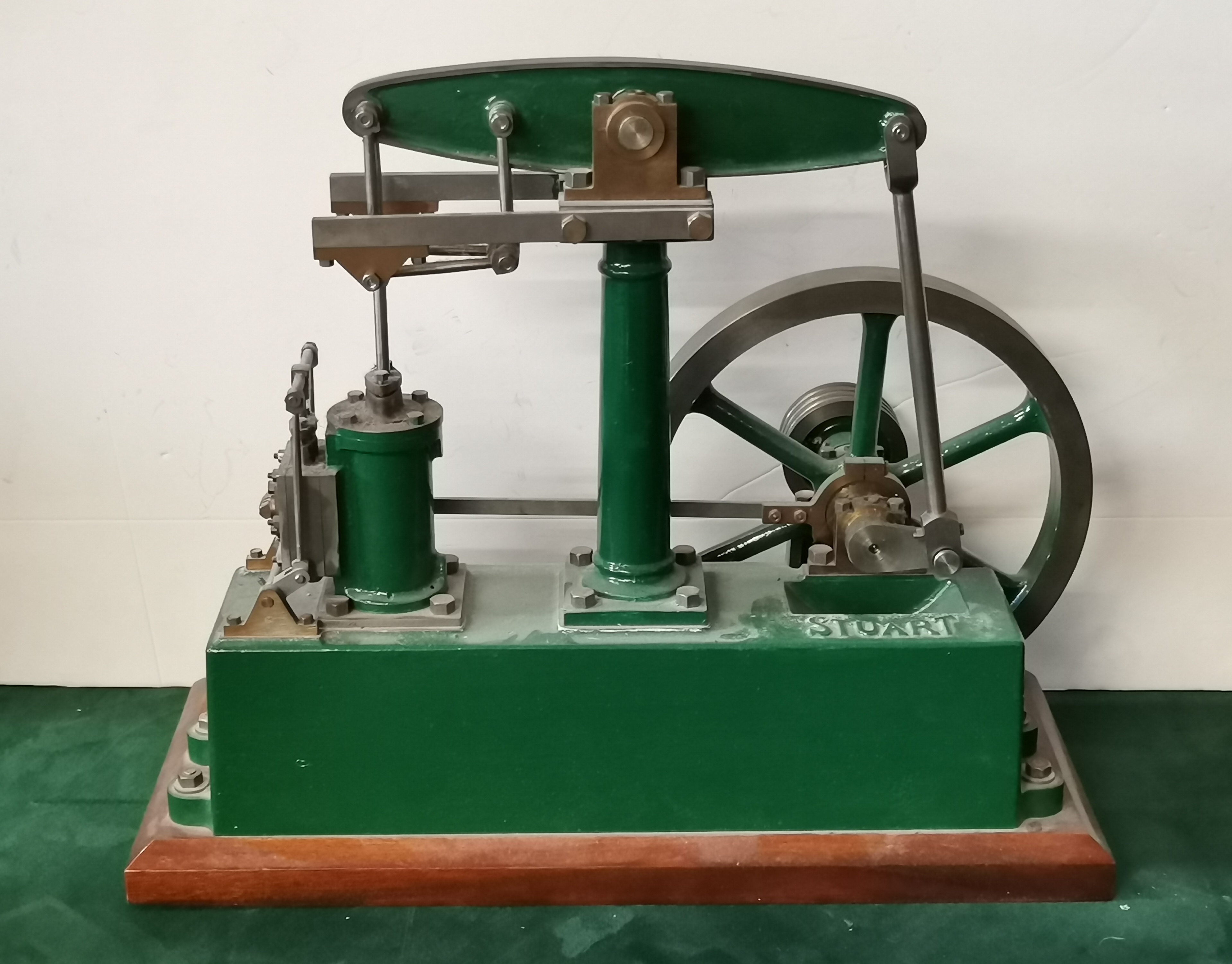 A Stuart live steam stationary beam engine on wooden plinth, painted ...