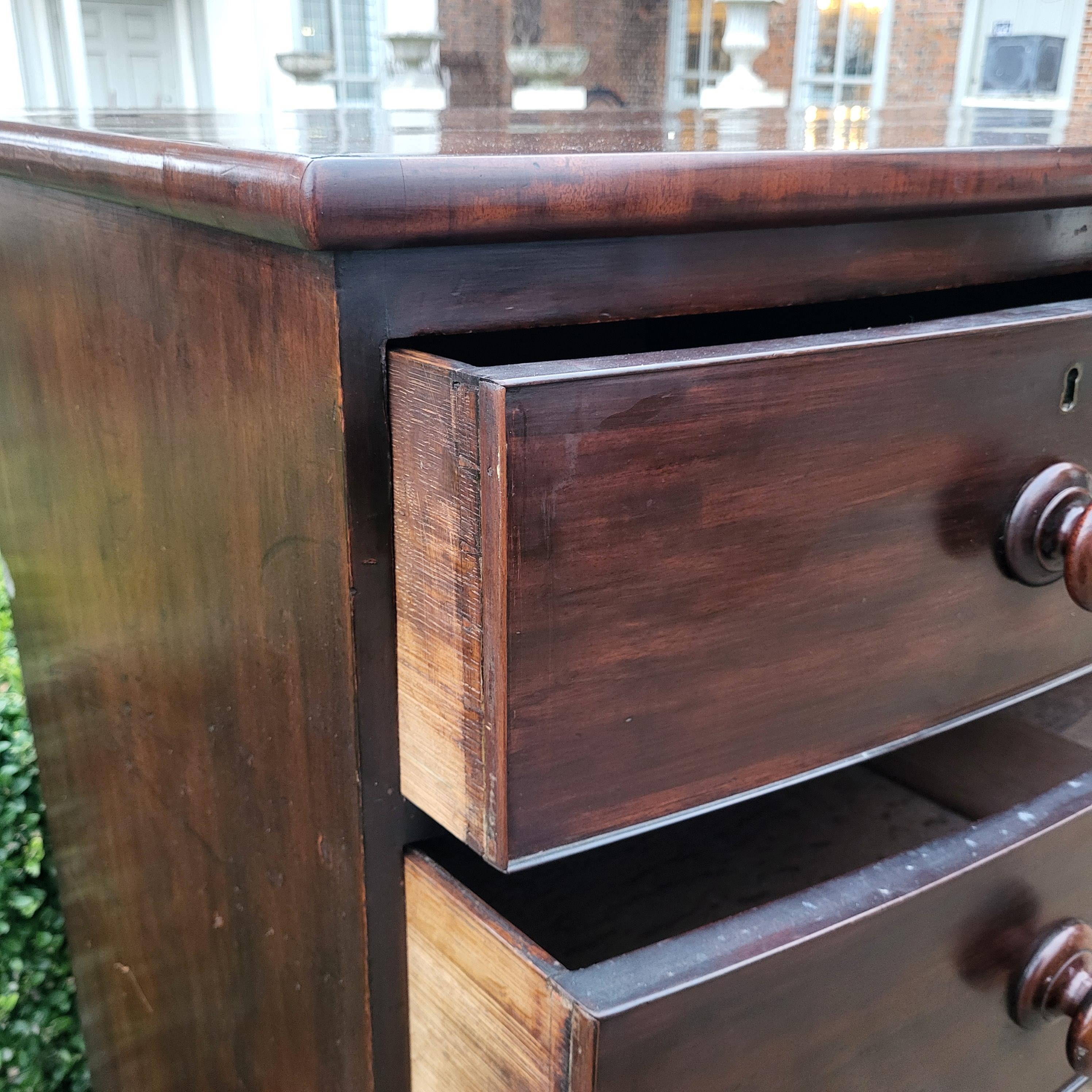 A VICTORIAN MAHOGANY BOW FRONTED CHEST With two short above three long drawers, wooden handles, on - Image 4 of 7