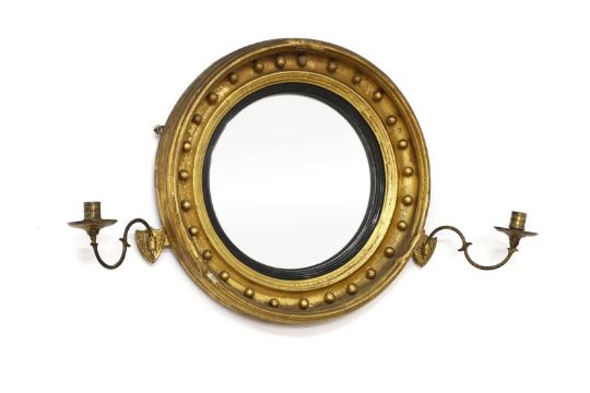 A gilt convex wall mirror,