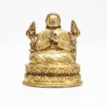 A Sino-Tibetan gilt-copper seated figure of the Lama Tsongkhapa,