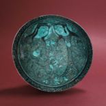 A turquoise glazed and painted Persian pottery bowl,