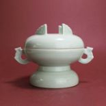 A Chinese celadon-glazed dou and cover,