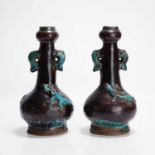 A pair of Chinese fahua-type garlic vases,