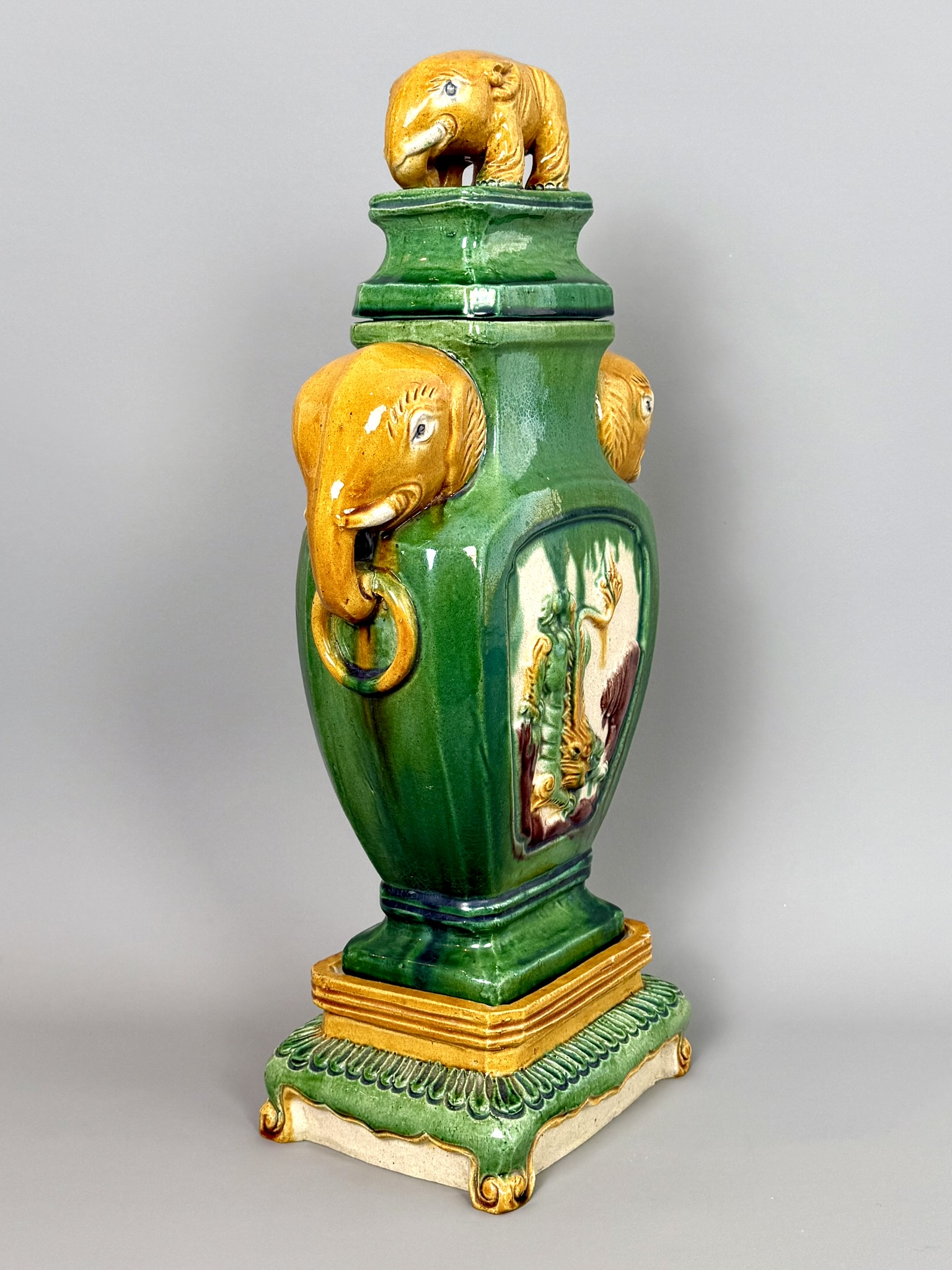 A Chinese green and ochre Sancai glazed elephant vase on stand - 20th century, the flattened, square - Image 3 of 5