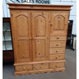 PINE WARDROBE WITH 3 PANEL DOORS & 4 DRAWERS OVER BASE WITH 3 DRAWERS,