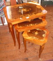 Nest of three decorated kitsch and lacquered tables with the smaller table being musical !