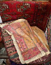 Persian rug 112cm long x 83cm wide, Indian fabric and two other textiles
