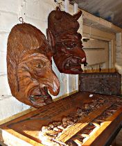 Pair German carved wood grotesque masks, a Black Forest carved box and a relief panel of the Last