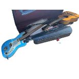 Two electric guitars, acoustic guitar, violin and two bows, banjo, ukelele and Torque TK50 amp.