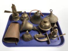 A group of brass and copper bells.