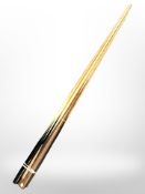 A bundle of six billiards cues.