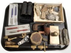 Two rustic pipes, letter opener in the form of a naval officer's dagger, pens, two desk blotters,