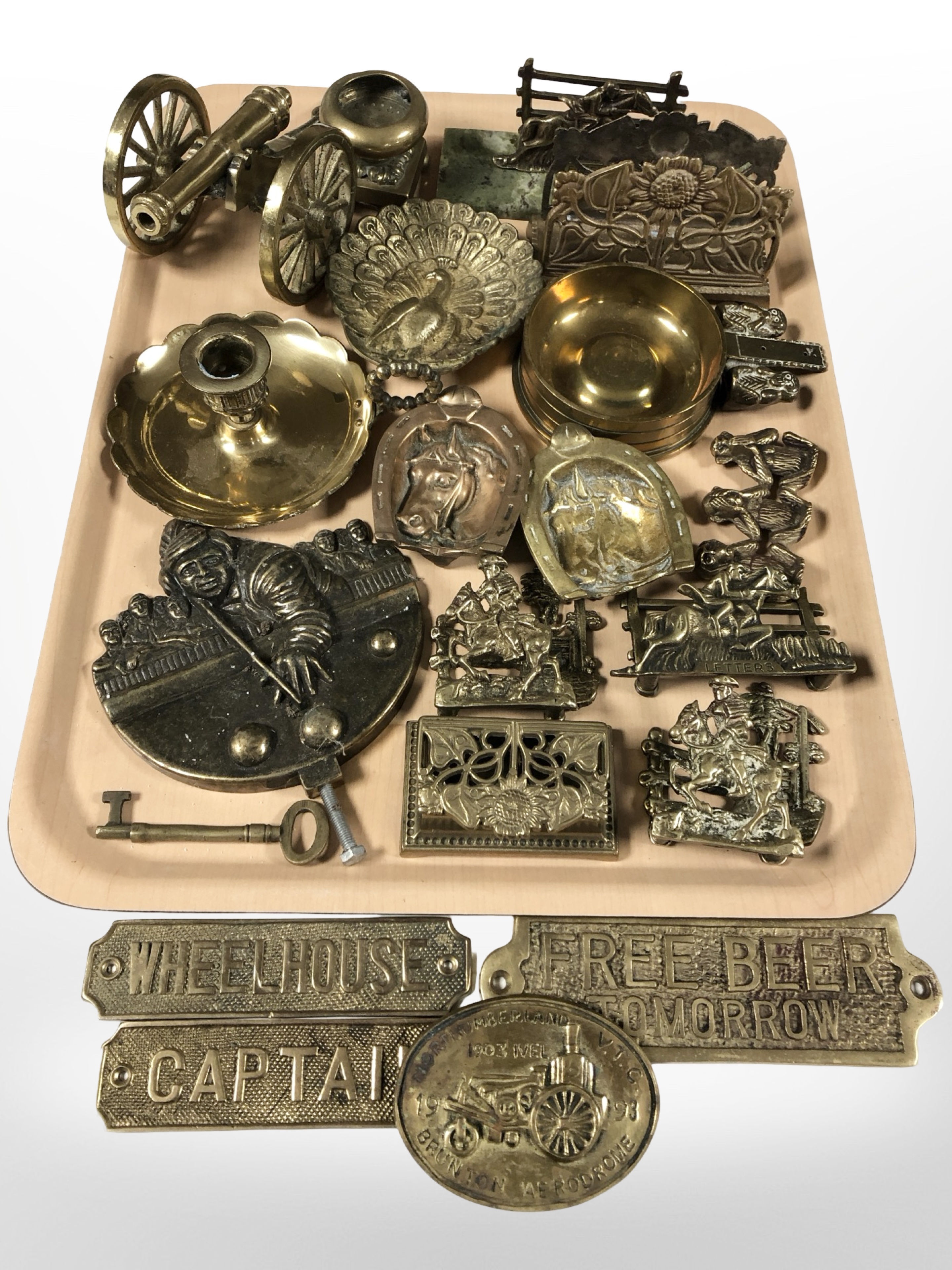 Brass wares including miniature cannon, correspondence rack, plaques, etc.