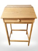 A Scandinavian blond oak clerk's writing stand,