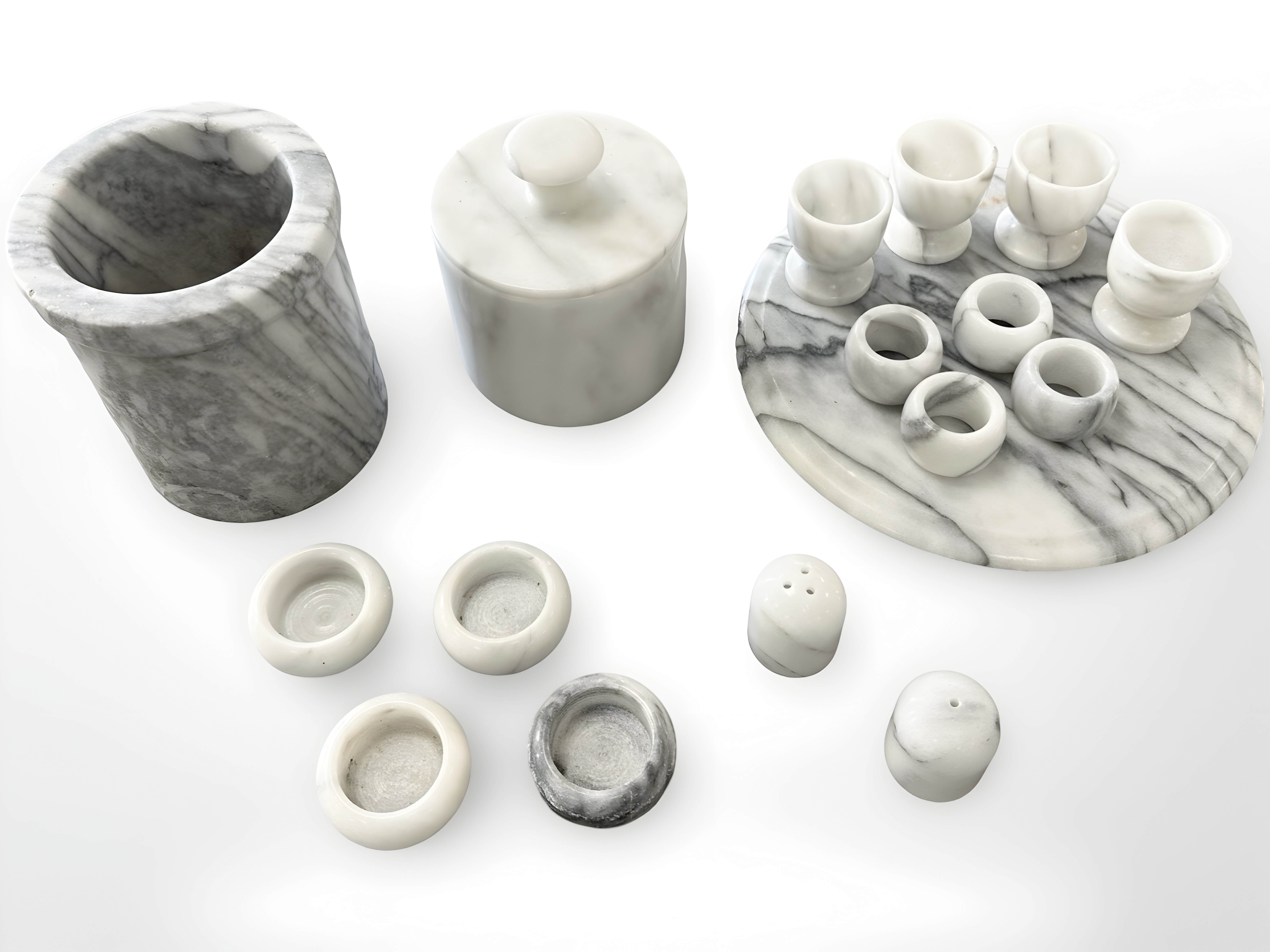 A group of white marble kitchen ware items including storage jars, serviette rings,