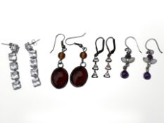 Four pairs of silver gem-set earrings