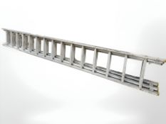 An aluminium triple extension ladder