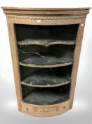 A Victorian pine bow fronted corner shelf