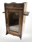 A late Victorian oak smokers cabinet, height 32 cm.