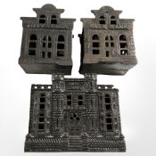 Three cast iron money banks, tallest 10.5 cm.