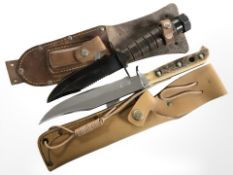 Two Bowie-style knives in leather sheathes, largest 27 cm long.