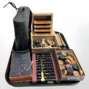 A quantity of boxwood chess pieces, draughts, abacus, dominoes,