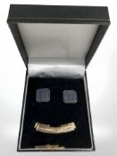 A pair of silver gilt Masonic cuff links and a silver gilt tie pin with motto 