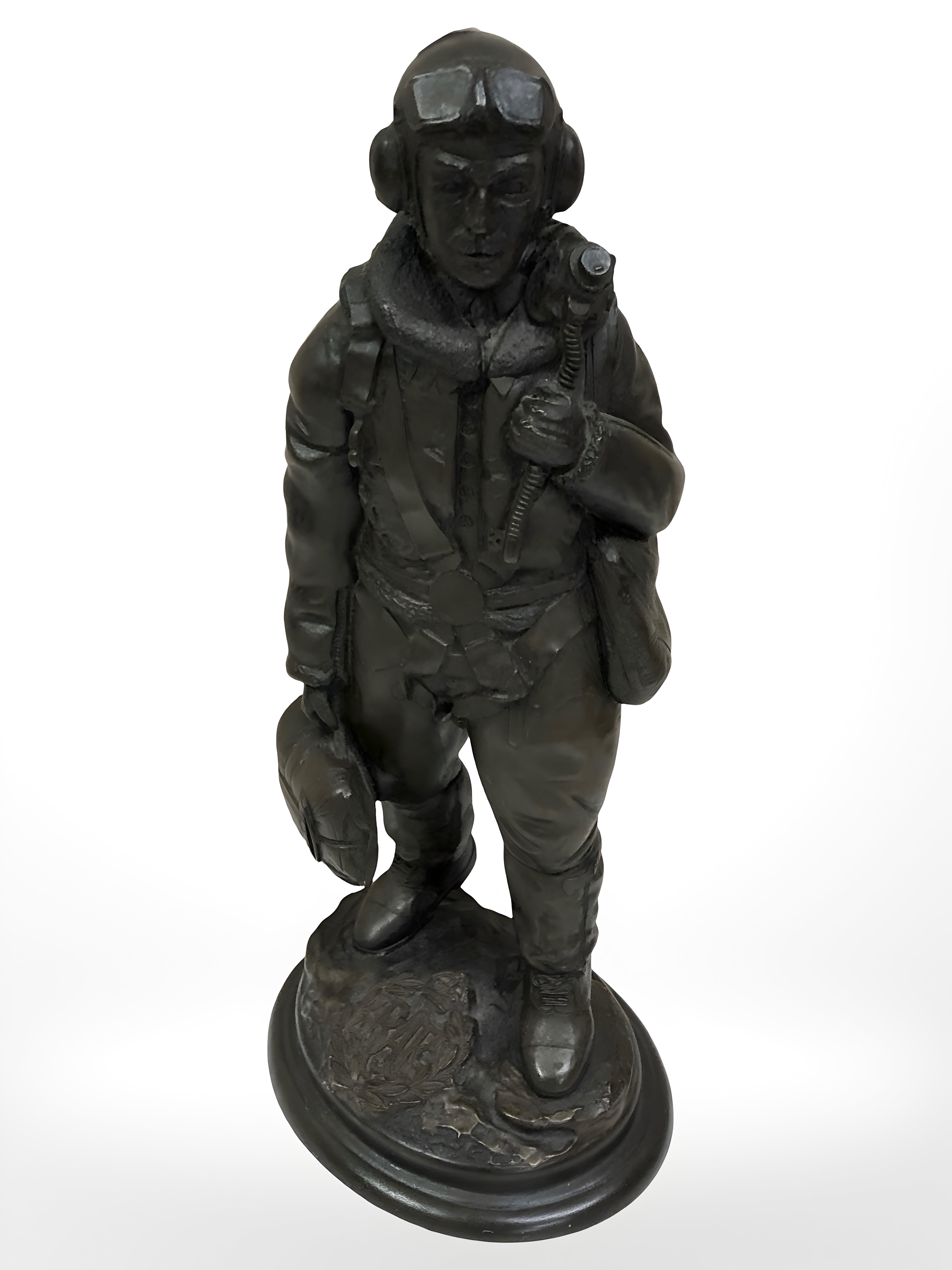 A bronze effect figure of an RAF pilot,