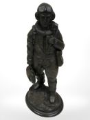 A bronze effect figure of an RAF pilot,