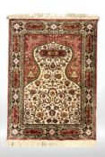 A machine made prayer rug, 154 cm x 96 cm.