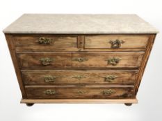A 19th century continental pine five drawer marble topped chest, 112 cm x 49 cm x 83 cm.