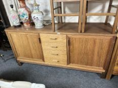A contemporary teak veneered sideboard, 175 cm x 50 cm x 85 cm.