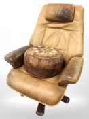 A 20th century tan leather swivel lounge armchair and a similar footstool (both distressed)