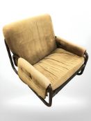 A 20th century tubular metal framed lounge armchair