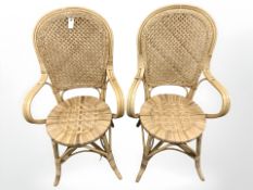 A pair of wicker armchairs