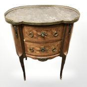 A French style walnut and brass mounted two drawer chest with gallery top,