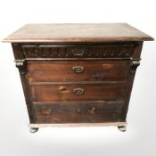 A 19th century continental stained pine four drawer chest on bun feet,
