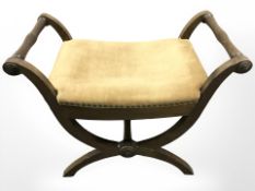 An oak X-framed stool,