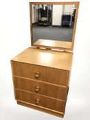 A teak three drawer mirror backed dressing chest,