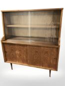 A 20th century teak sliding glass door side cabinet, 92 cm x 36 cm x 105 cm.