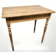 An early 20th century pine table,
