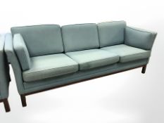 A late 20th century Danish three seater settee in blue upholstery, length 209 cm.