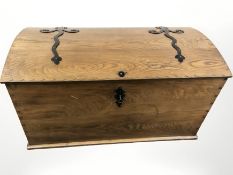 An early 20th century Scandinavian oak and wrought iron bound domed topped chest,