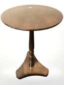 A mahogany circular occasional table.