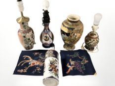 Three 20th century oriental porcelain/earthen ware lamp bases and two further vases,