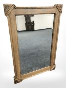 An oak bevelled mirror, length 82 cm.